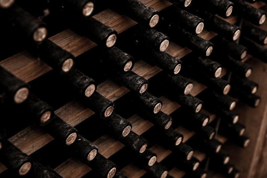 stacked wine bottles on top of each other at 'Ktima Karipidis'